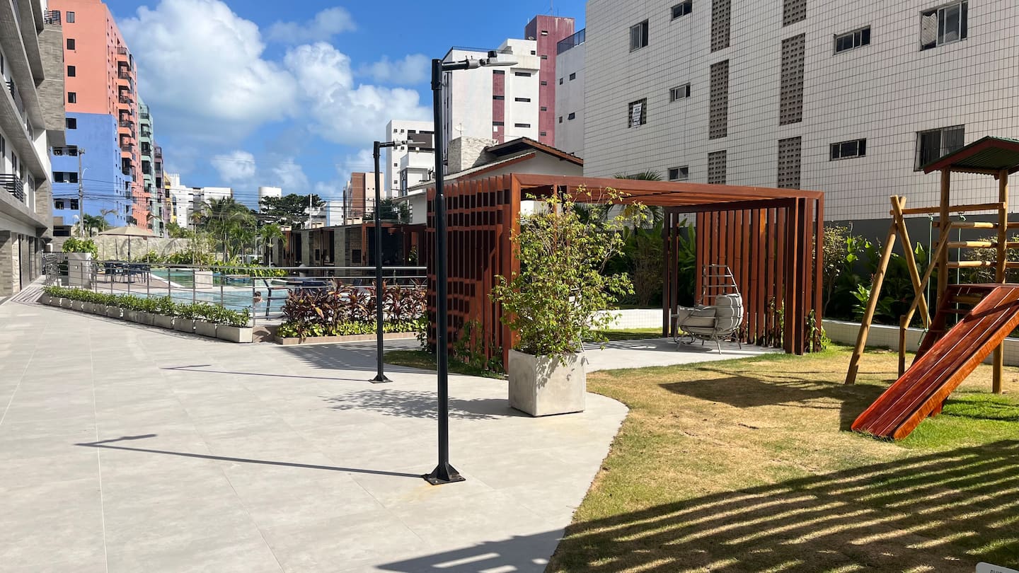 Área verde com pergolado — NOA Residence Club