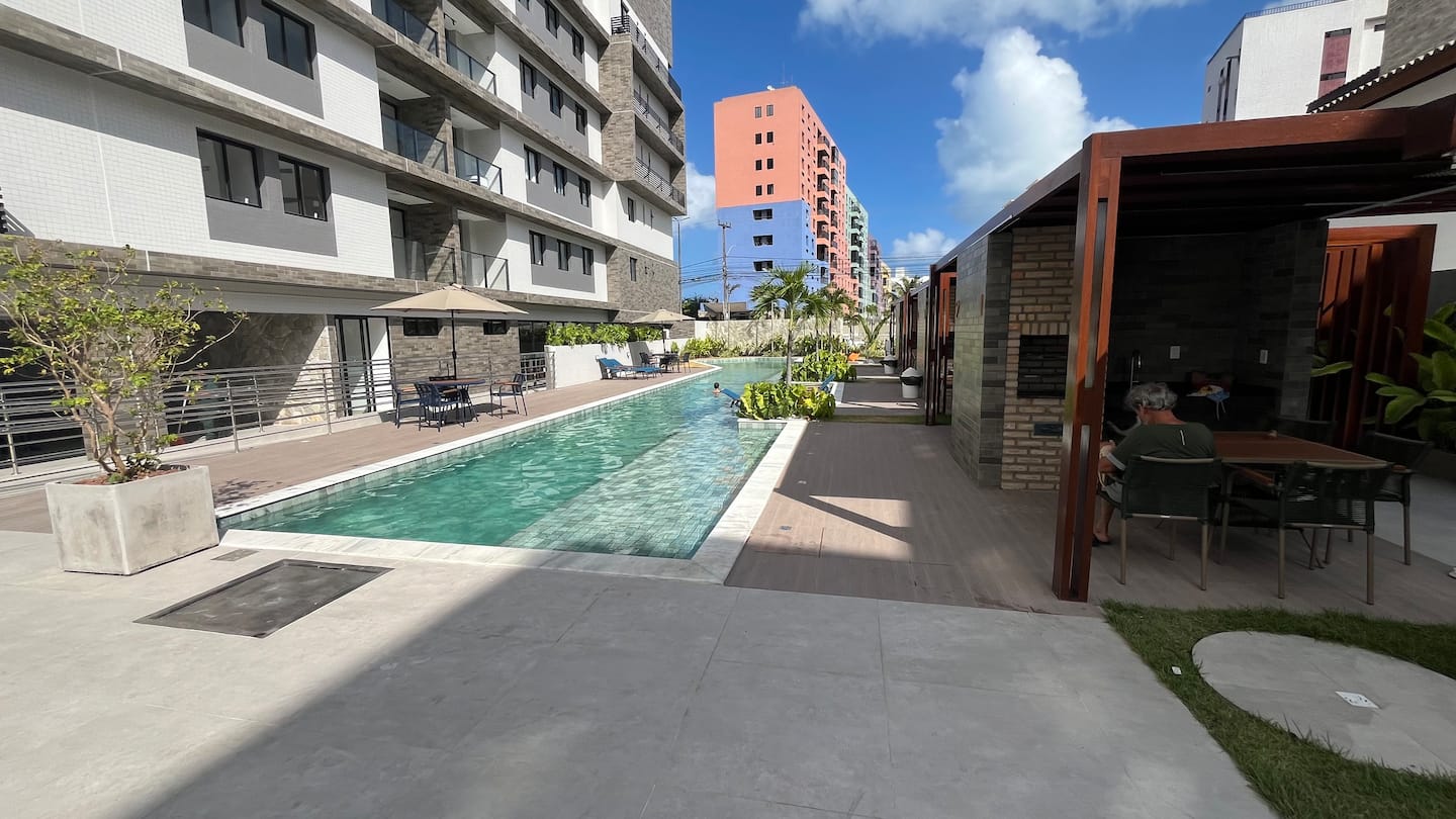 Piscina e churrasqueira — NOA Residence Club